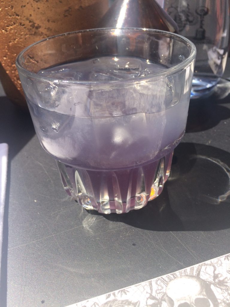 Photo: a purple-coloured, rum-based drink.